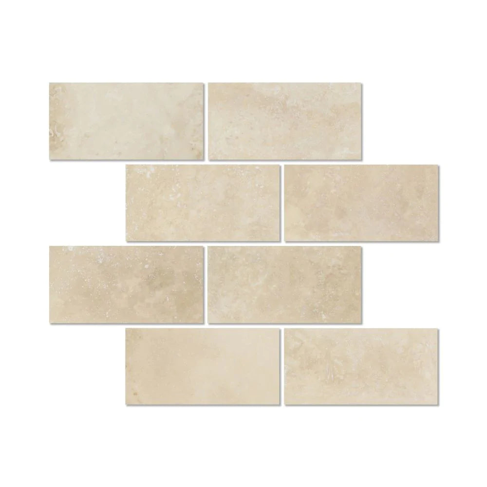 Flat view of Ivory Travertine 3x6 Honed Tile in warm tan and cream tones