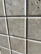 Flat view of Ivory Travertine 4x4 Honed Tile with deep bevel edge