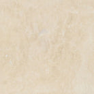 Close-up of Ivory Travertine 4x4 tile showing matte surface and subtle variation