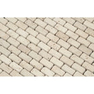 Close-up of Ivory Travertine 5/8"x1" Tumbled Mosaic highlighting tumbled finish and textured surface