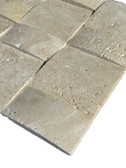 Close-up of Ivory Travertine basketweave mosaic showing arched detailing and creamy tones