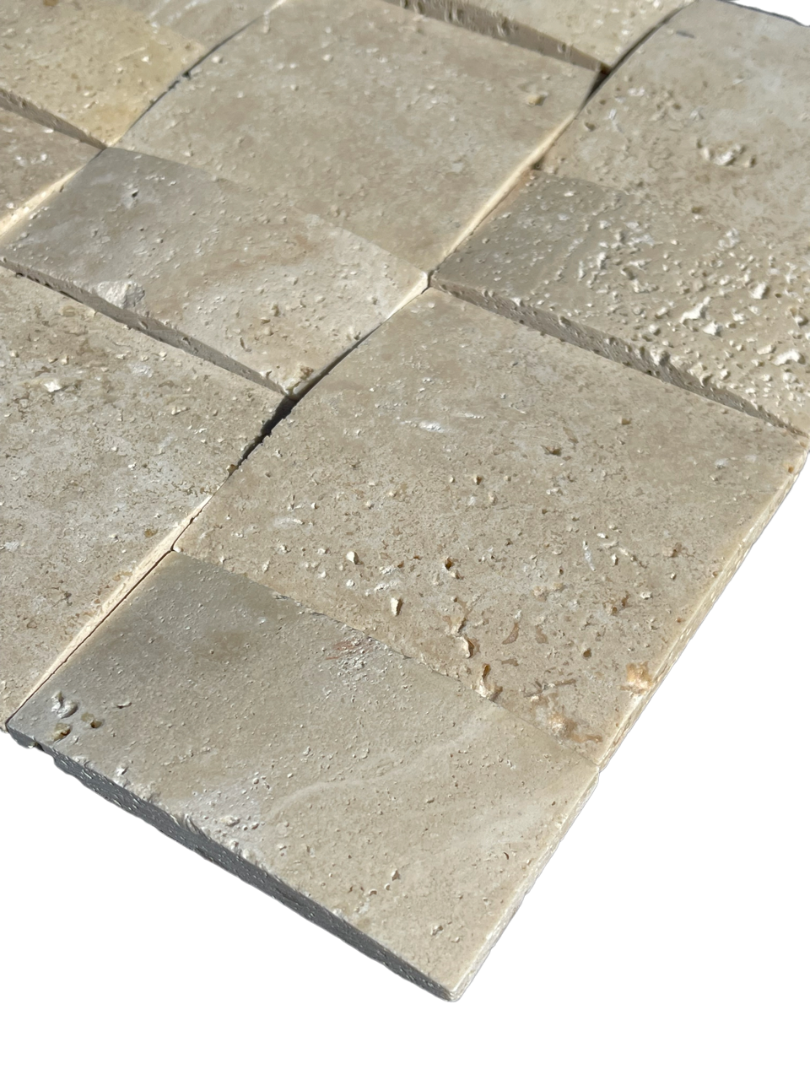 Close-up of Ivory Travertine basketweave mosaic showing arched detailing and creamy tones