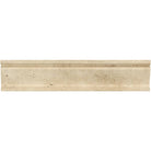 Close-up of Ivory Travertine molding showing soft golden veining and profile detail