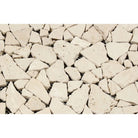 Close-up of irregular tumbled travertine pieces in random mosaic format