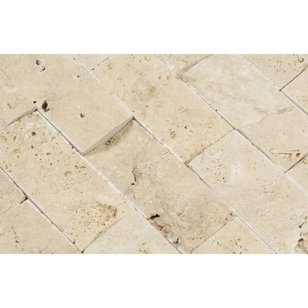 Close-up of 2x4 splitface mosaic tiles showing raw texture and natural stone color