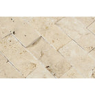 Close-up of 2x4 splitface mosaic tiles showing raw texture and natural stone color