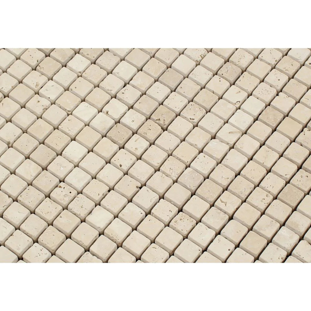 Close-up of Ivory Travertine Tumbled Mosaic 5/8"x5/8" showing surface texture and soft-edged finish