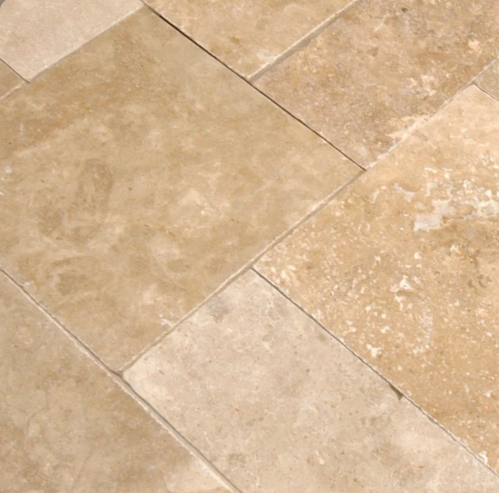 Close-up of Light Walnut Travertine showing texture and walnut beige tones
