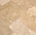 Close-up of Light Walnut Travertine showing texture and walnut beige tones
