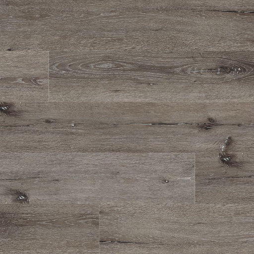 Flat lay of Ludlow Luxury Vinyl Tile showing soft gray base with realistic charcoal wood grain