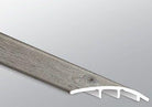 Close-up of Mezcla plank surface showcasing charcoal wood knots and textured matte finish