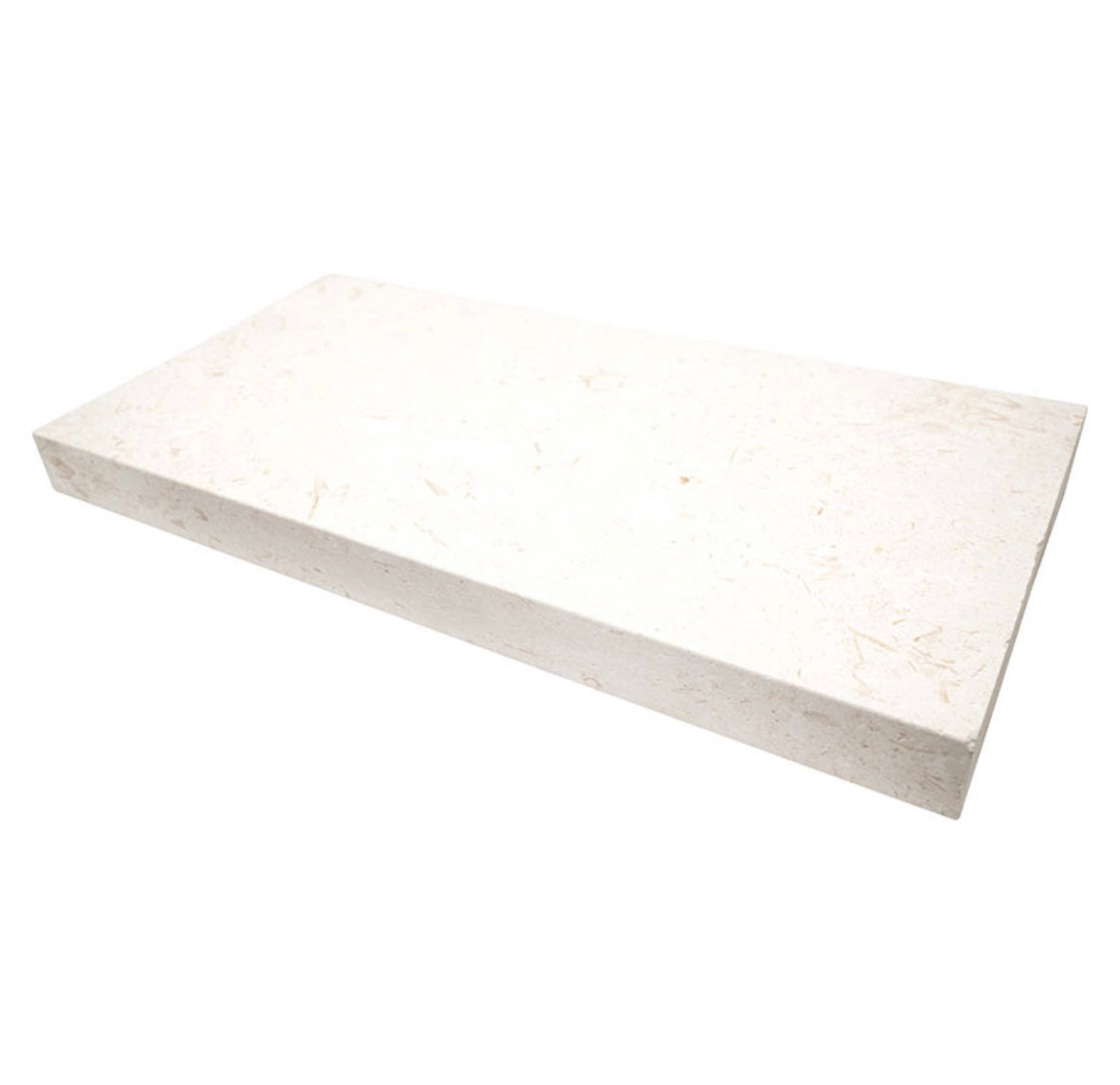 Close-up of Myra Limestone showing cream tone, modern edge, and speckled finish