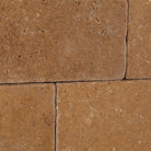 Rustic textured surface of Noce Travertine 3x6 tile
