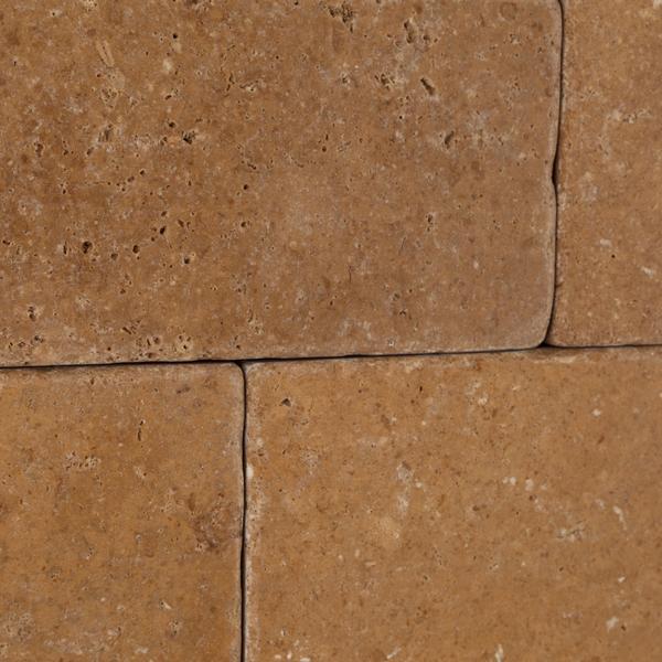 Rustic textured surface of Noce Travertine 3x6 tile