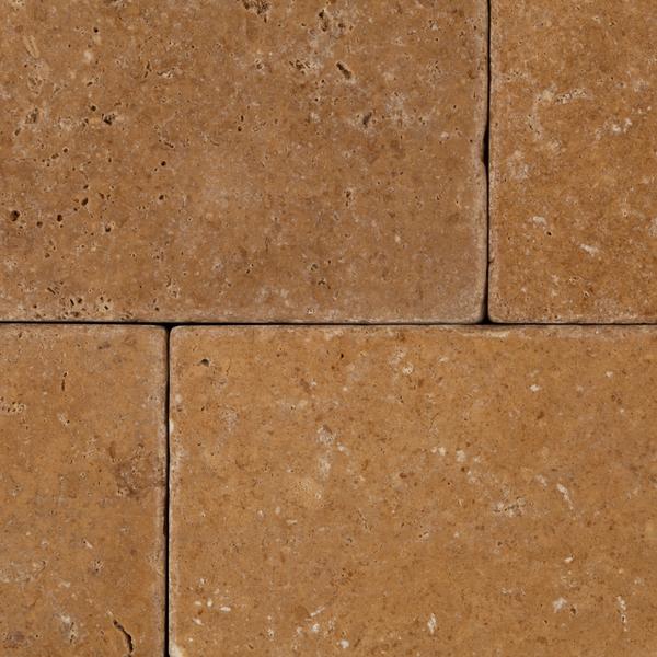 Rustic textured surface of Noce Travertine 3x6 tile