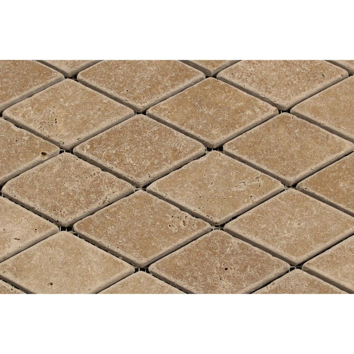 Close-up of Noce Travertine diamond tumbled mosaic finish