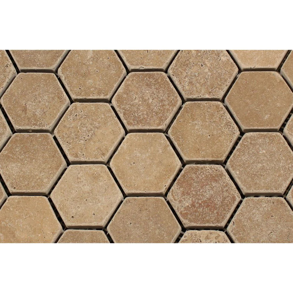 Detailed view of tumbled Noce Travertine hexagon tiles showing rustic texture