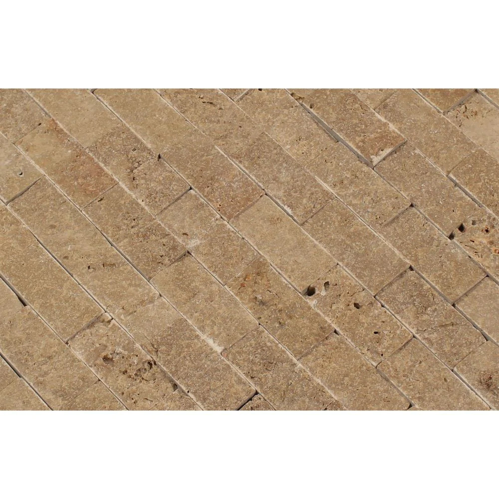 Close-up of Noche Travertine Splitface finish showing textured surface and earthy variation