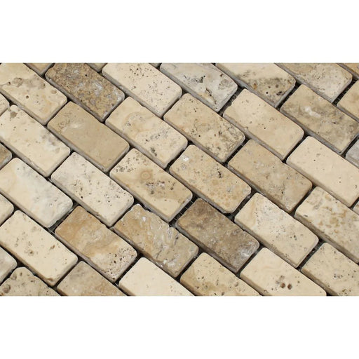 1x2 tumbled brick pattern in neutral travertine tones
