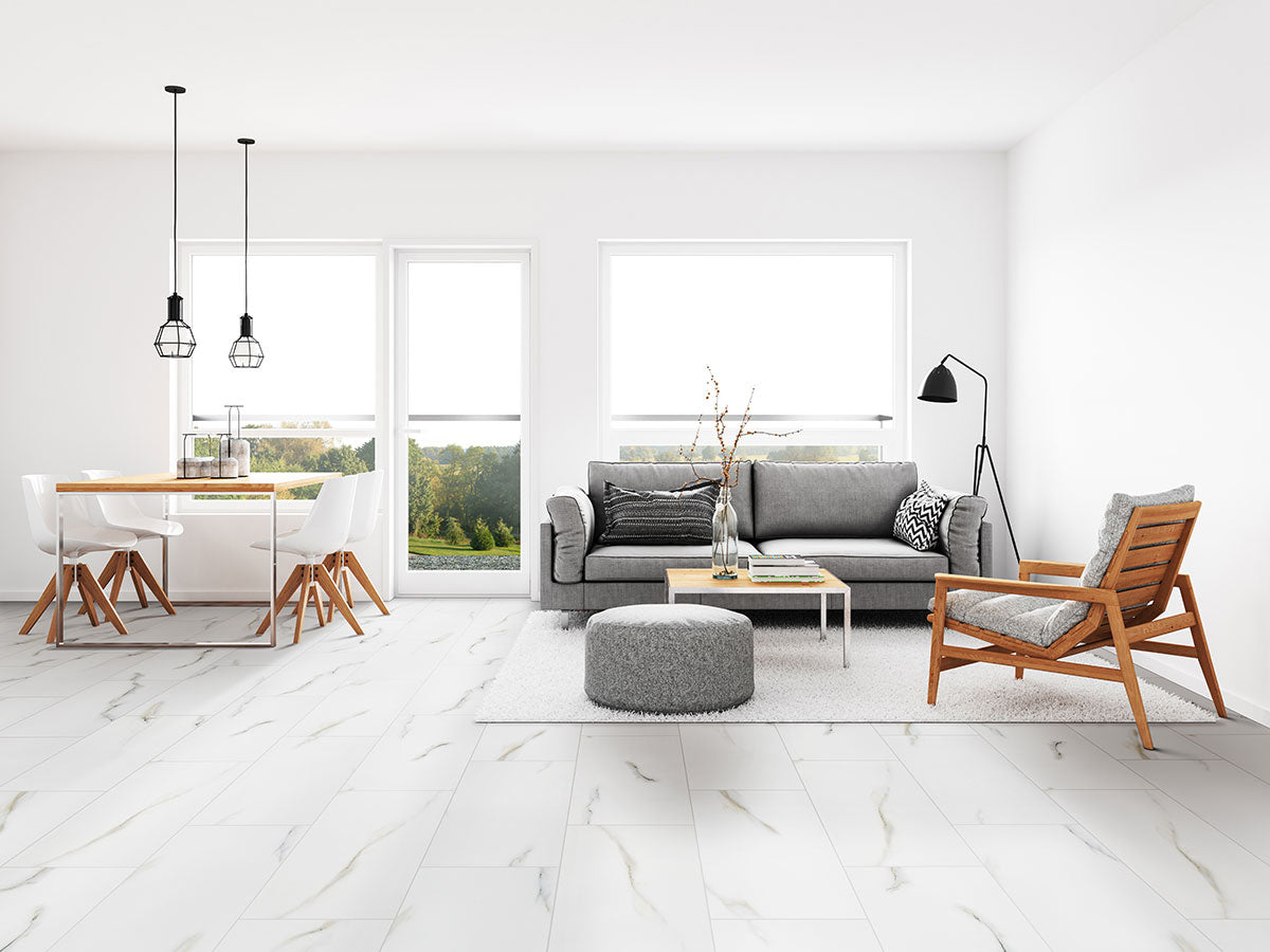 Close-up of Praia Bianca porcelain tile showing fine Carrara-style veining and glossy polish