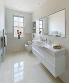 Close-up detail of Praia Grey polished porcelain tile showing fine gray veining