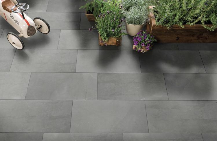 Close-up view of Sande Gray tile showing polished surface and subtle grey veining