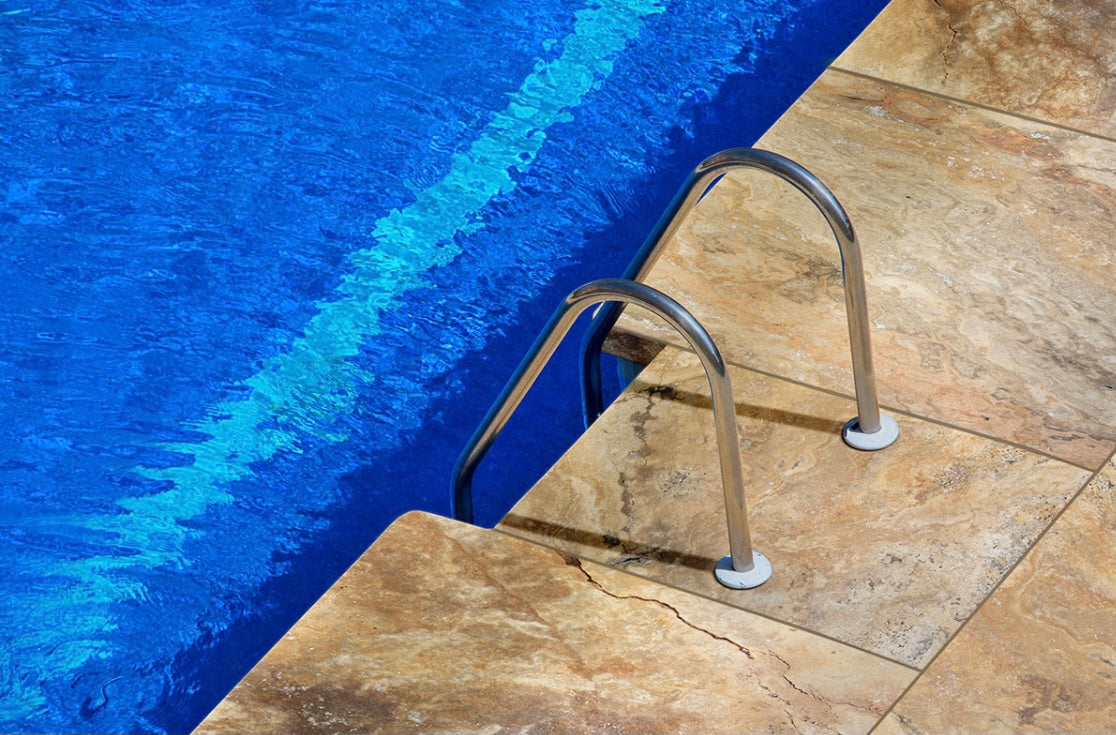 Installed view of Scabas Travertine Pool Coping 12x24 with tumbled finish