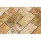 Close-up of deep beveled 2x4 travertine tiles showing texture and veining
