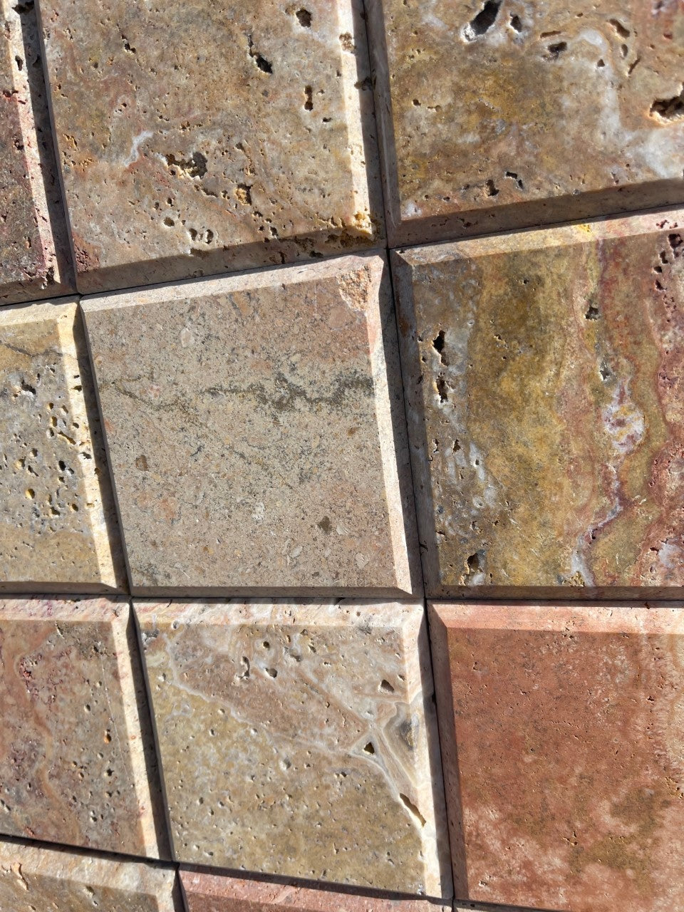 Close-up of Scabos 4x4 showing texture and earthy red-gold color blend
