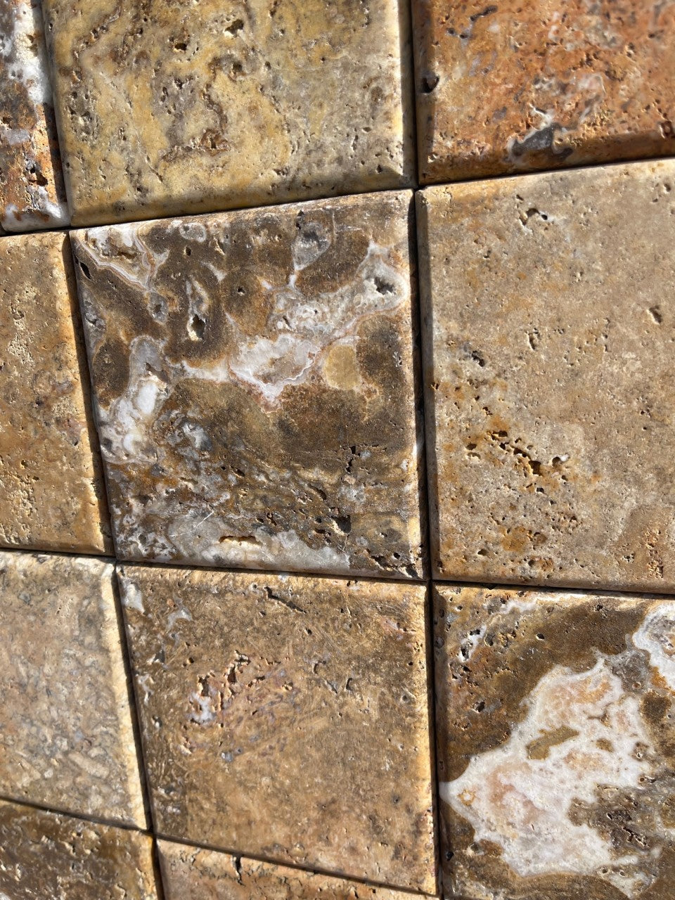 Close-up of 4x4 Scabos tile showing color variation and smooth edge detail