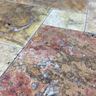 Close-up of brushed and chiseled surface texture with red-gold color blend