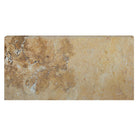 Close-up of Sienna Gold Travertine showing golden-beige tones and bullnose edge
