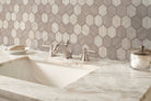 Close-up of Silva Oak Mosaic showing directional veining and 2-inch hex chips in matte finish