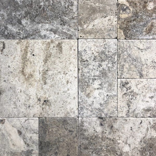 Close-up of Silver Mini Travertine Paver showing tumbled texture and color blend

