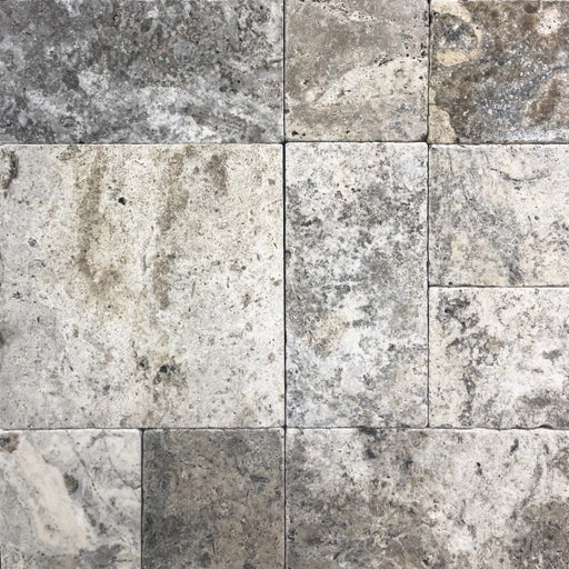 Close-up of Silver Mini Travertine Paver showing tumbled texture and color blend

