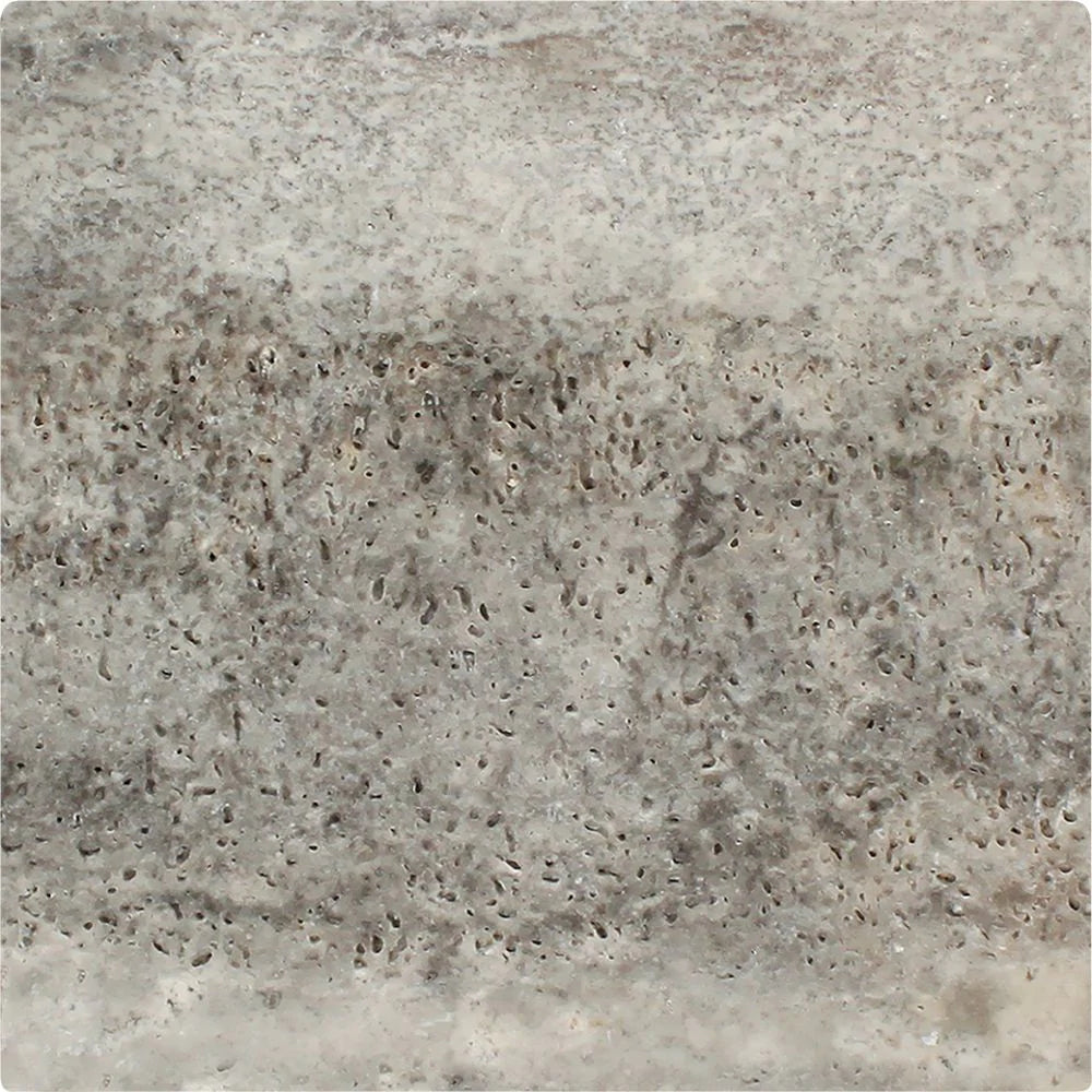 Close-up of 12x12 Silver Travertine showing tumbled edge and natural texture