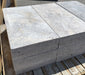 Close-up of 2" thick Silver Travertine Coping showing smooth edge and natural color