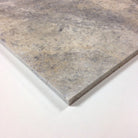 Close-up of honed Silver Travertine 18x18 showing smooth finish and subtle veining