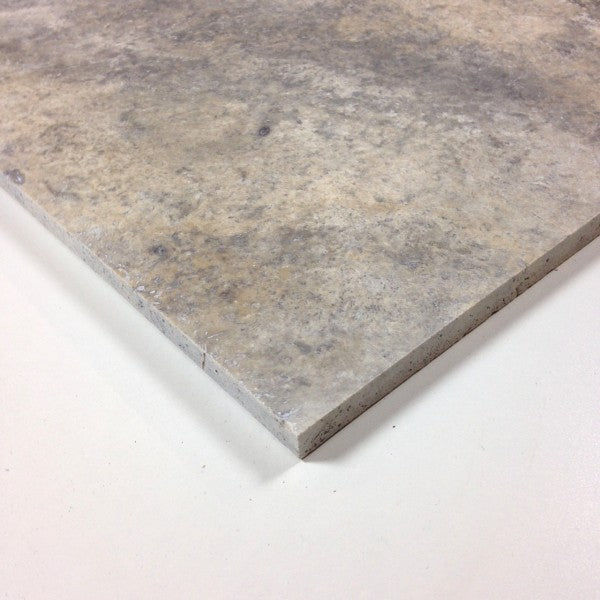 Close-up of honed Silver Travertine 18x18 showing smooth finish and subtle veining