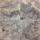 Close-up of honed Silver Travertine 18x18 showing smooth finish and subtle veining