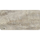 Close-up of 3x6 Silver Travertine showing rounded tumbled edges and textured surface