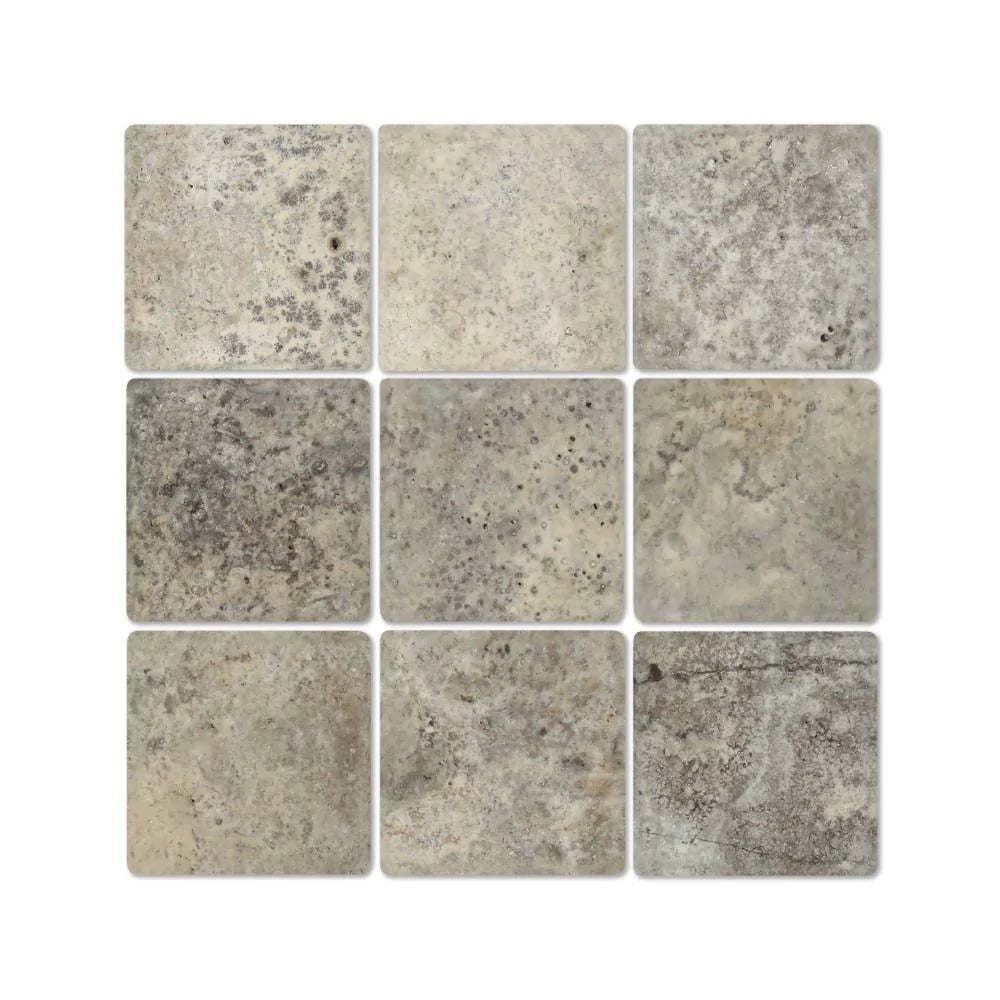 Flat view of Silver Travertine 4x4 tile in tumbled finish, showing gray, tan, and cream tones
