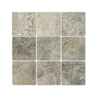 Flat view of Silver Travertine 4x4 tile in tumbled finish, showing gray, tan, and cream tones