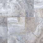 Close-up of Silver Travertine paver showing textured tumbled surface