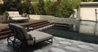 Silver Travertine Stacked Stone Panel installed on pool wall