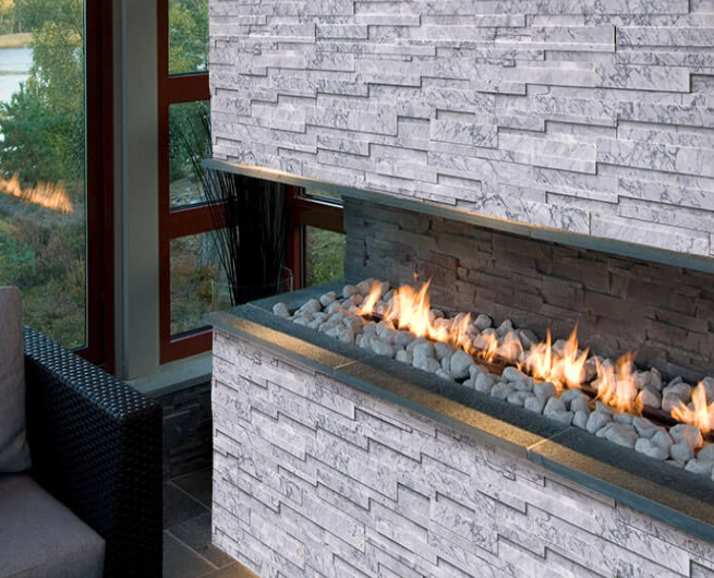 Close-up of Statuarietto Capri marble featuring soft gray base and deep gray veins