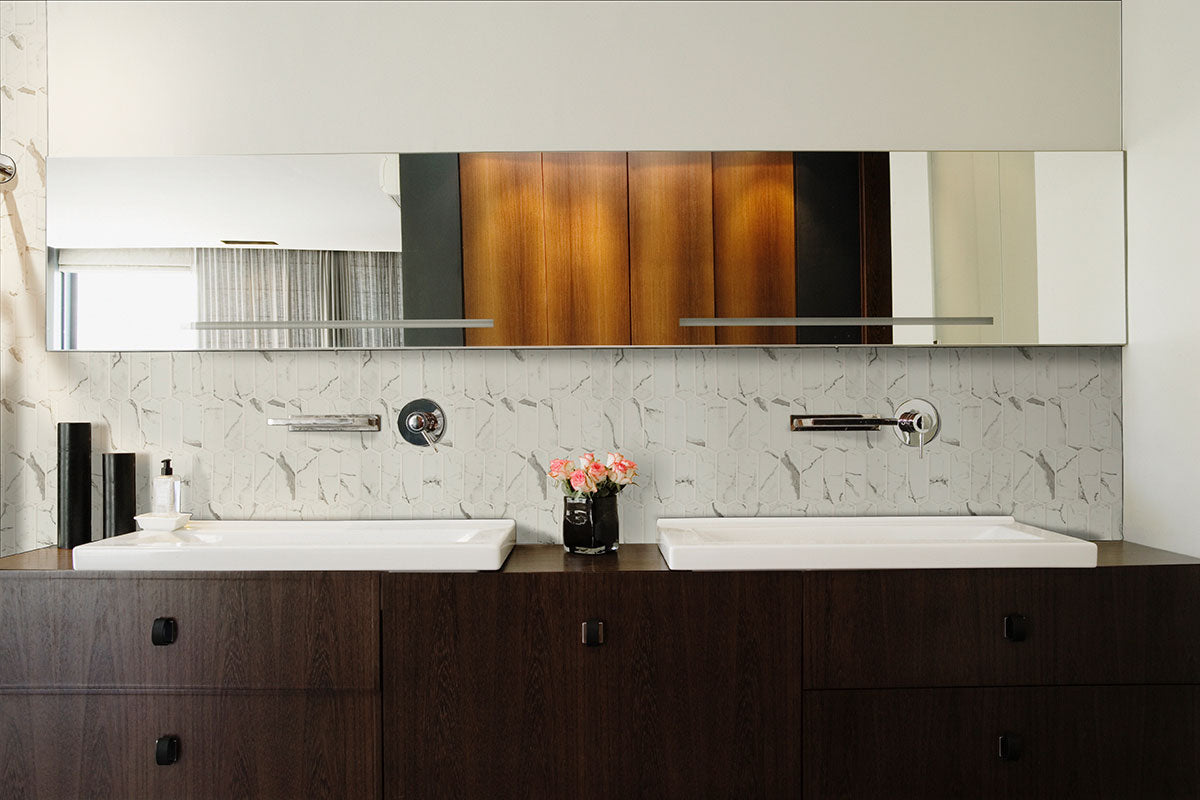 Close-up of picket-shaped recycled glass mosaic with soft gray veining and matte finish