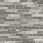 Close-up of Tarvos Mosaic showing linear recycled glass tiles with soft directional veining