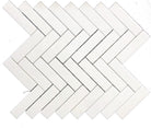 Close-up of Thassos White Herringbone pattern showing 1x4 marble tiles
