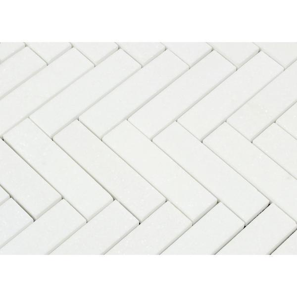 Close-up of Thassos White Herringbone pattern showing 1x4 marble tiles